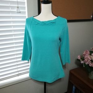 Retro inspired teal knit top with square braid neckline